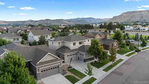 an aerial view of residential houses with outdoor space and street view