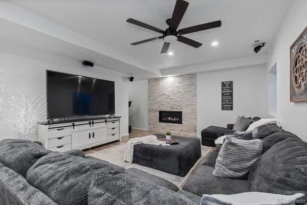 a living room with furniture and a flat screen tv