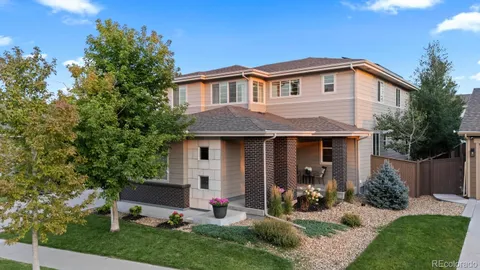 a view of a house with backyard and garden