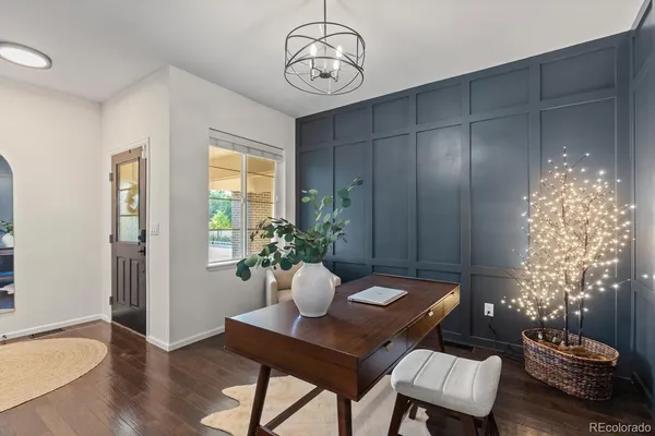 a view of a dining room with furniture window and wooden floor