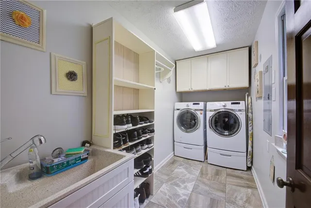 a view of a hallway with entryway and wooden floor
