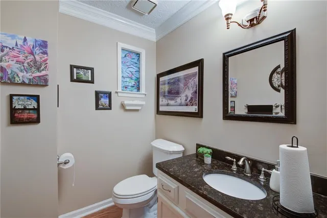 a bedroom with a bed table and a chair