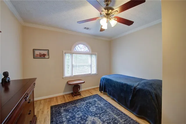 a bathroom with a granite countertop sink a toilet and a mirror