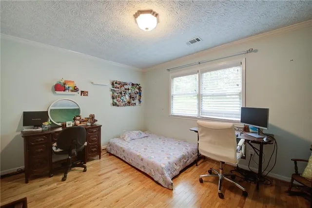 a living room with furniture a chandelier and a piano