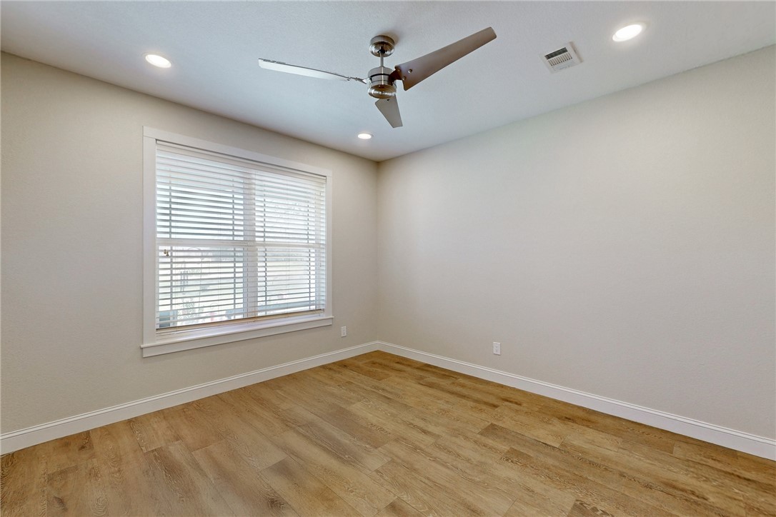 4168 Owensville Cemetery Road Franklin, TX 77856 - Photo 23 of 35 an empty room with a window and a ceiling fan