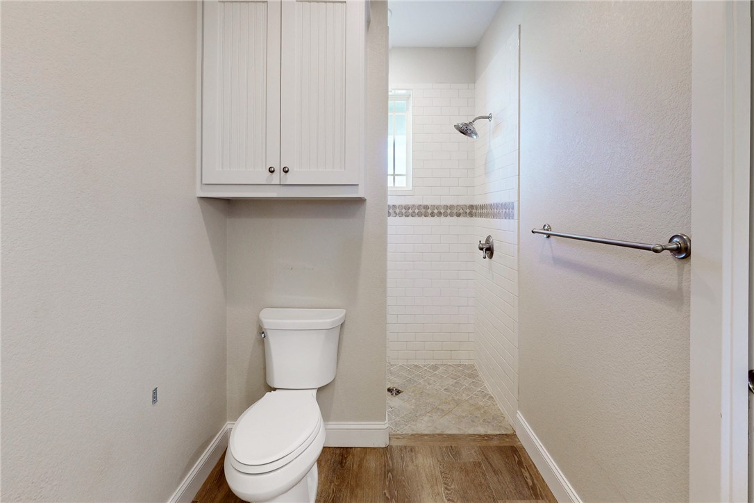 4168 Owensville Cemetery Road Franklin, TX 77856 - Photo 26 of 35 a bathroom with a toilet and a shower