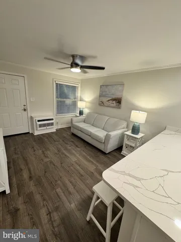 a bedroom with two beds and a desk