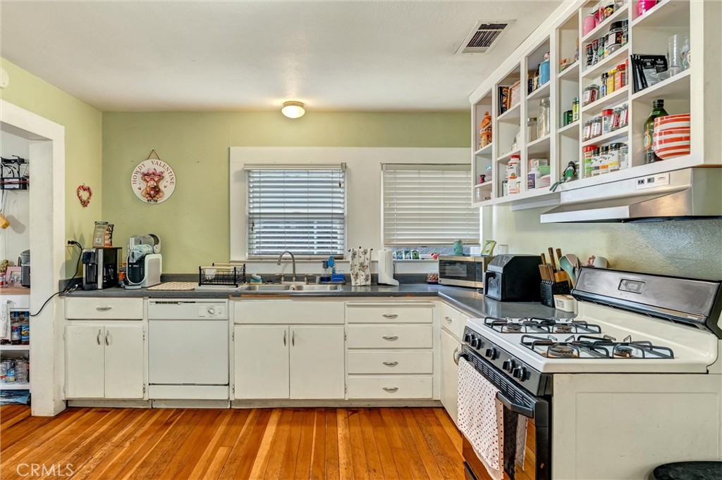 1200 Ivy Street Chico, CA 95928 - Photo 12 of 31 a kitchen with a stove and a sink