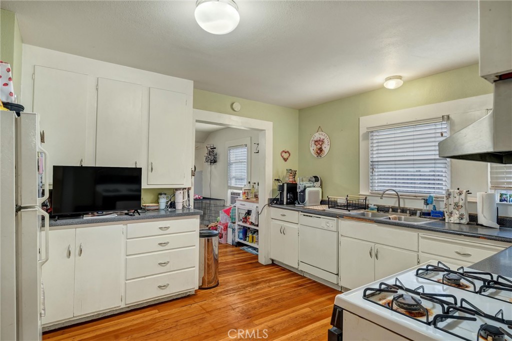 1200 Ivy Street Chico, CA 95928 - Photo 13 of 31 a kitchen with a sink stove and cabinets