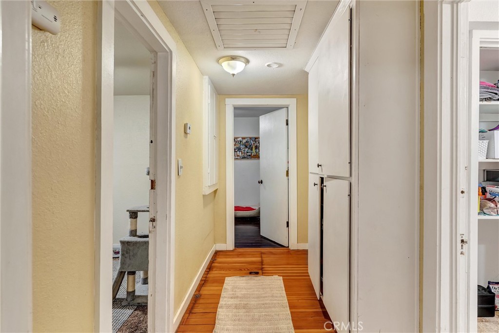 1200 Ivy Street Chico, CA 95928 - Photo 16 of 31 a view of a hallway with wooden floor and staircase