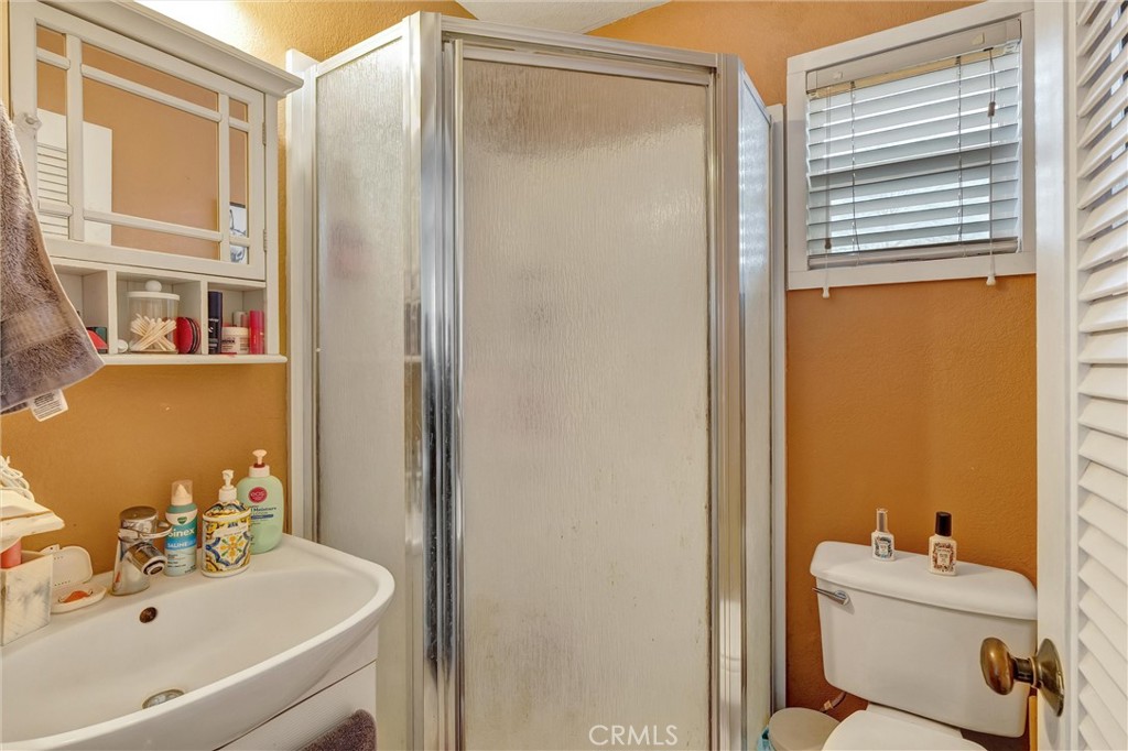 1200 Ivy Street Chico, CA 95928 - Photo 21 of 31 a bathroom with a sink a toilet and shower