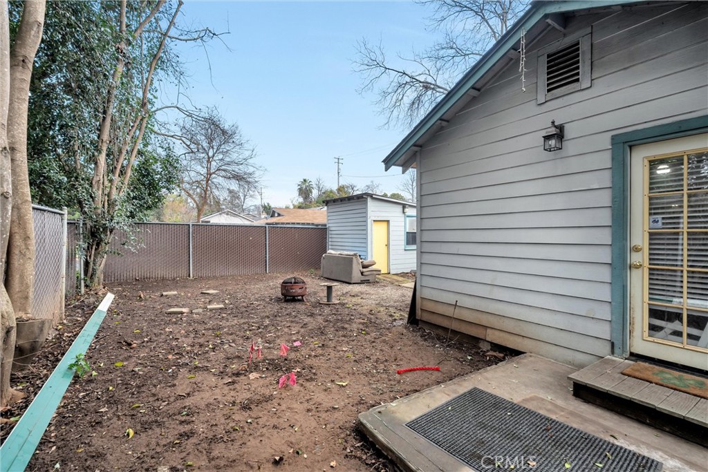 1200 Ivy Street Chico, CA 95928 - Photo 25 of 31 a backyard of a house with barbeque oven and door
