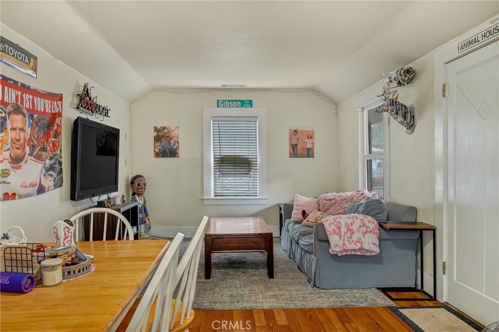 1200 Ivy Street Chico, CA 95928 - Photo 4 of 31 a bedroom with furniture and a flat screen tv