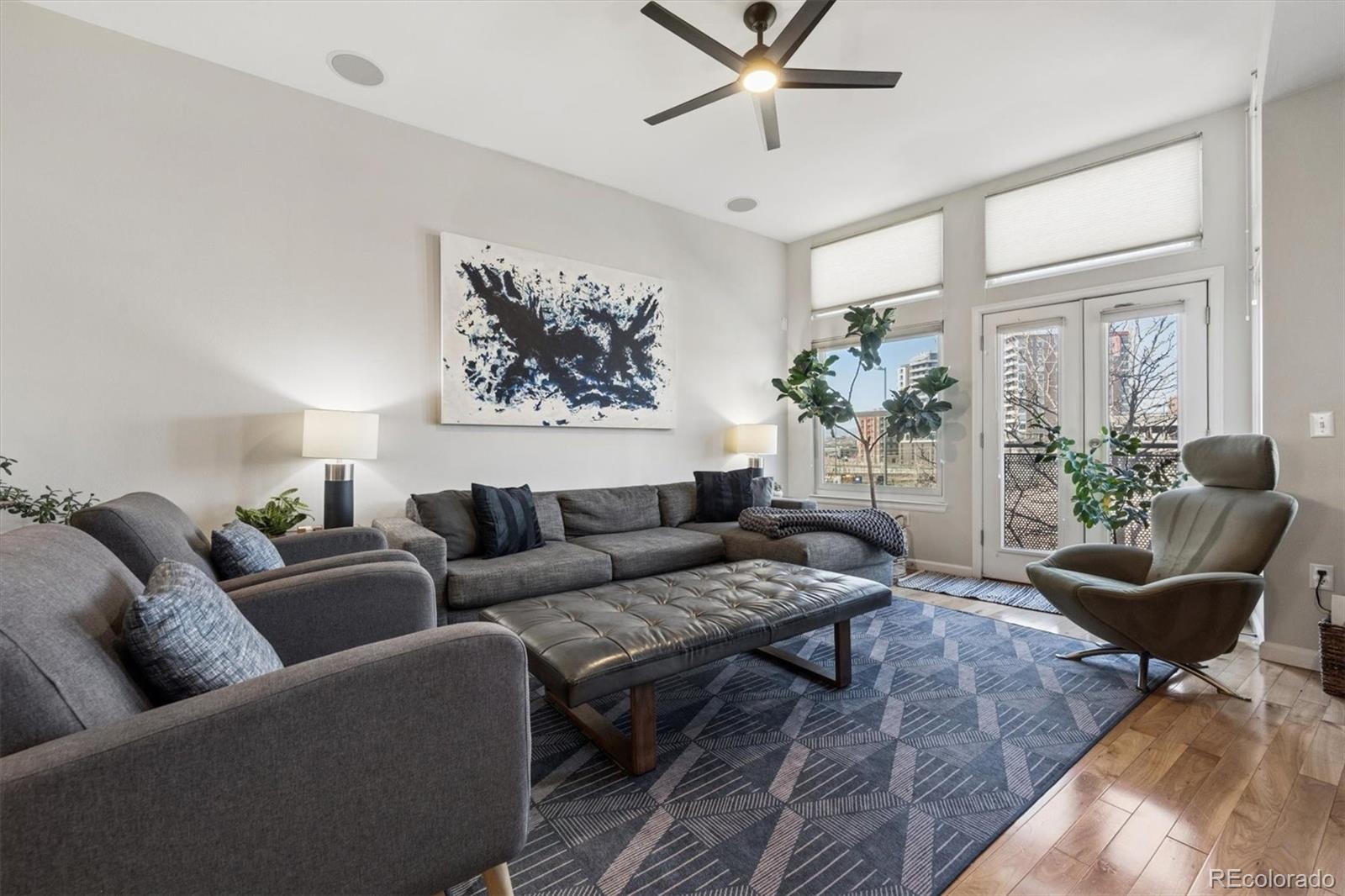 2680 Blake Street, Unit 7 Denver, CO 80205 - Photo 11 of 36 a living room with furniture and a potted plant