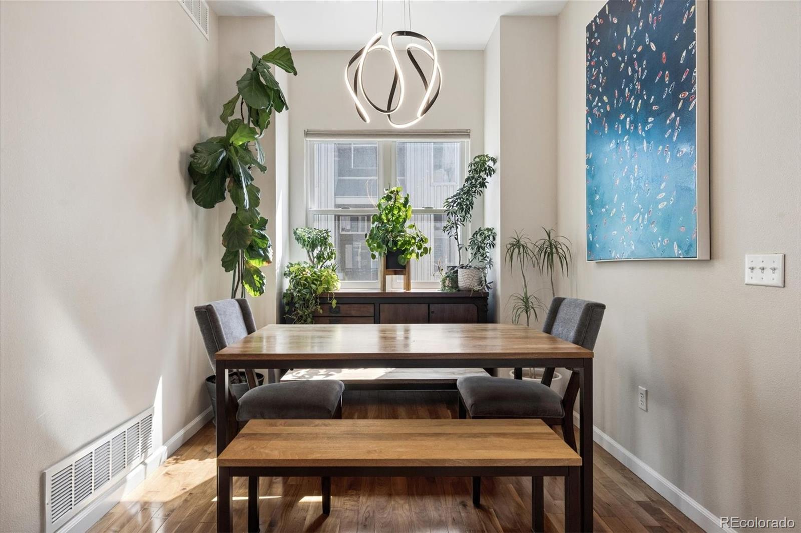 2680 Blake Street, Unit 7 Denver, CO 80205 - Photo 12 of 36 a view of table and chair with potted plant