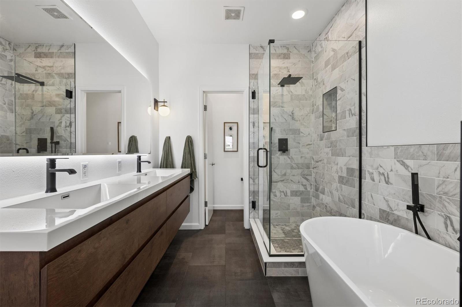 2680 Blake Street, Unit 7 Denver, CO 80205 - Photo 16 of 36 a bathroom with a bathtub and a sink