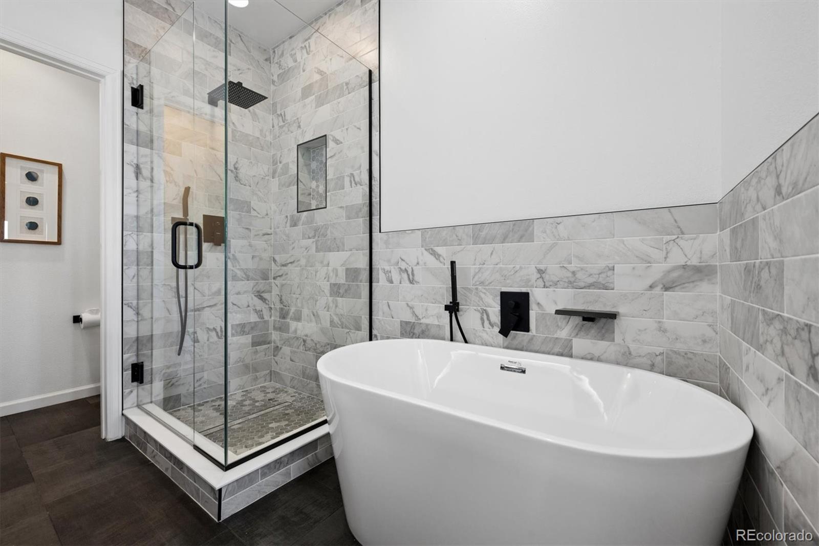 2680 Blake Street, Unit 7 Denver, CO 80205 - Photo 18 of 36 a white bath tub sitting next to a shower