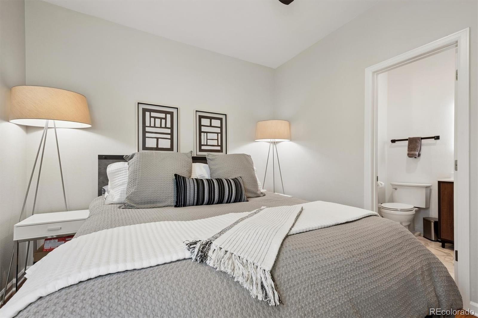 2680 Blake Street, Unit 7 Denver, CO 80205 - Photo 20 of 36 a bedroom with a bed and a lamp