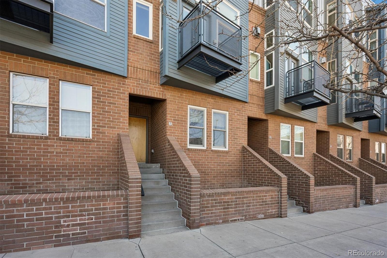 2680 Blake Street, Unit 7 Denver, CO 80205 - Photo 2 of 36 a front view of a multi story residential apartment building
