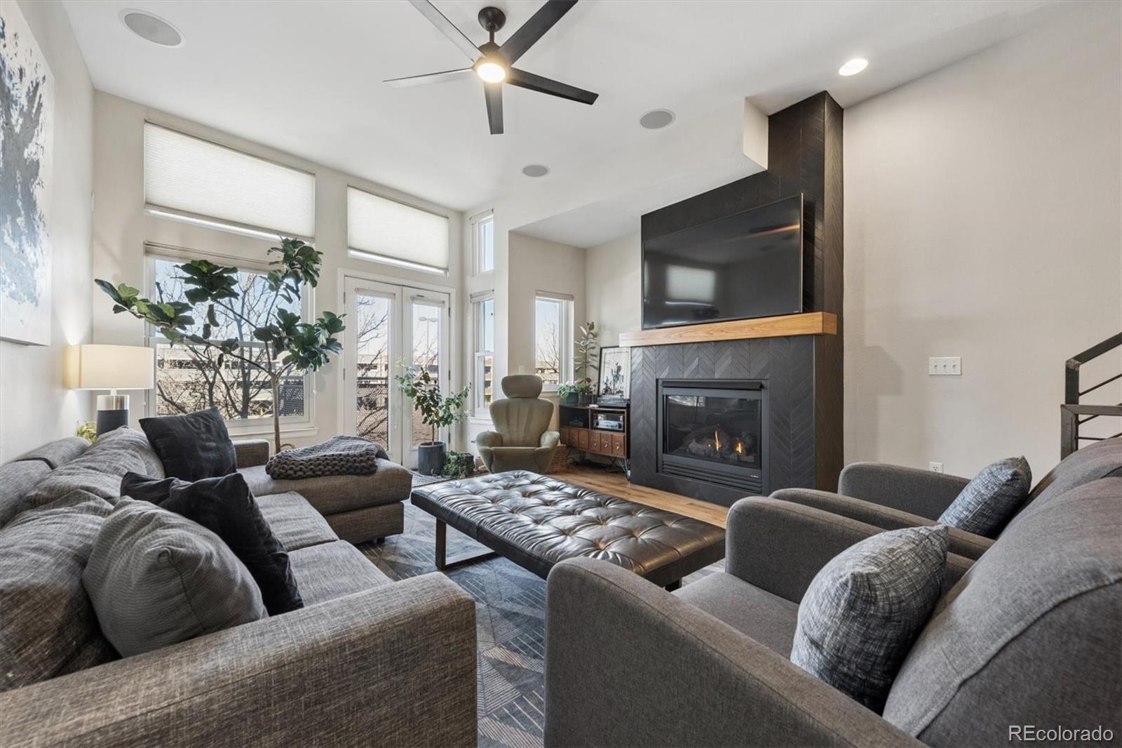 2680 Blake Street, Unit 7 Denver, CO 80205 - Photo 10 of 36 a living room with furniture and a fireplace