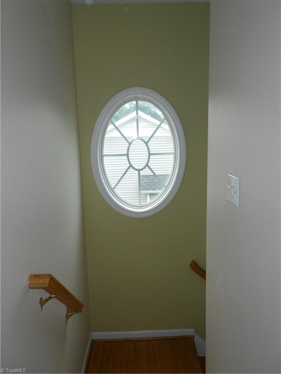 3704 Shadow Ridge Drive High Point, NC 27265 - Photo 14 of 24 The window adds light and character to the stairwell.