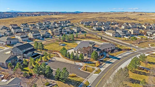 an aerial view of residential building and ocean view