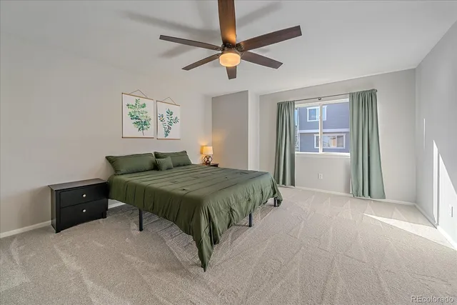 a bedroom with a bed and a cabinets