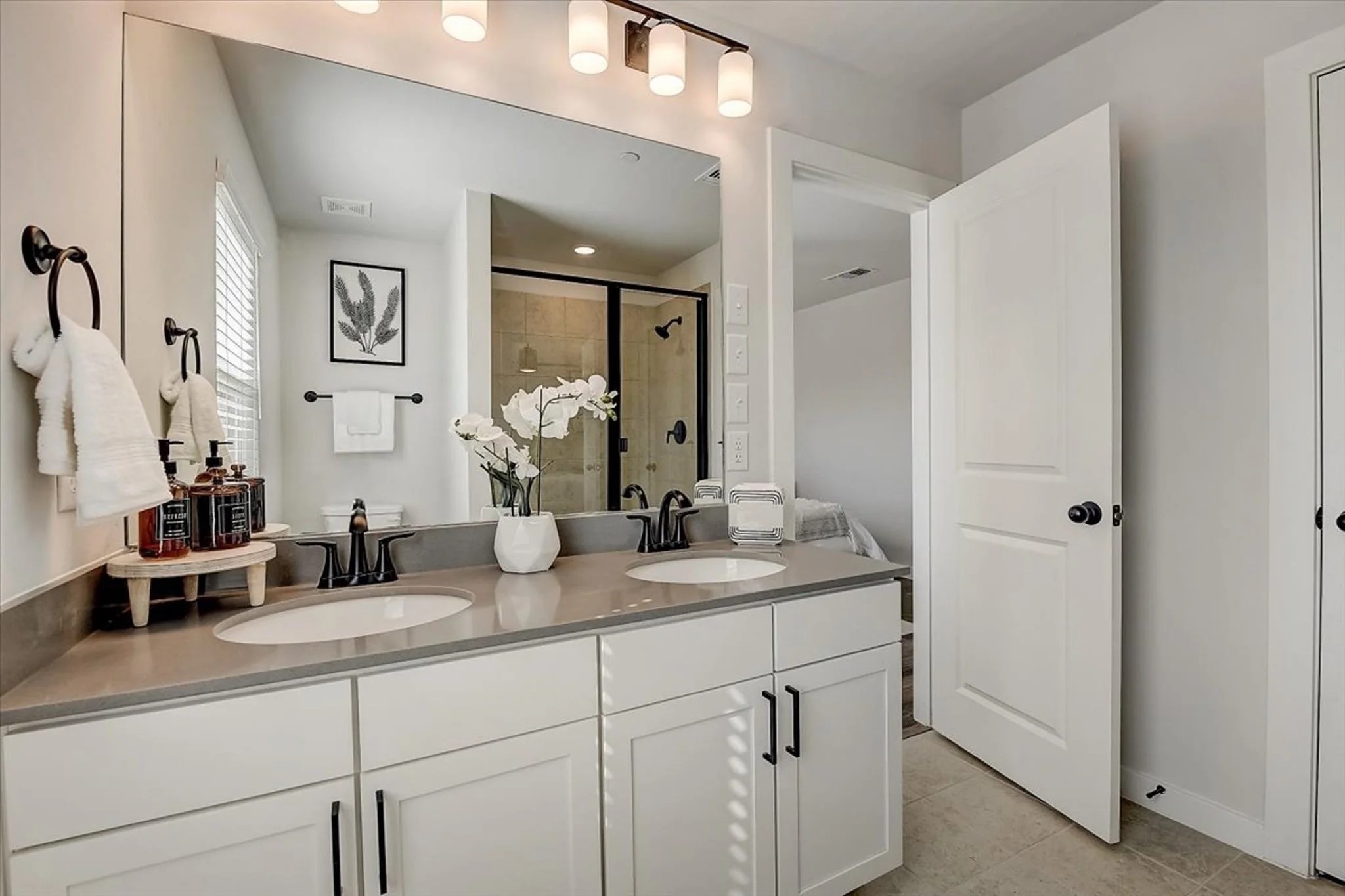 15101 Litsey Crk Drive, Unit 14726R Roanoke, TX 76262 - Photo 11 of 21 a bathroom with double sink and a mirror