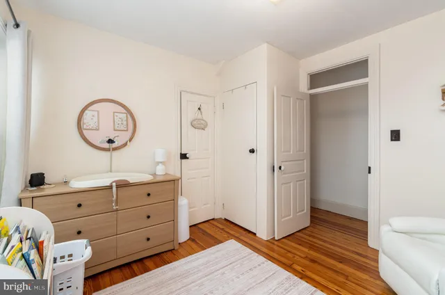 a view of bedroom with a bed and a dresser