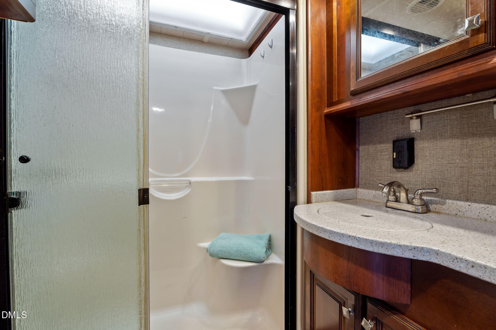 115 Mahto Drive Spring Hope, NC 27882 - Photo 11 of 19 a bathroom with a granite countertop sink and a mirror