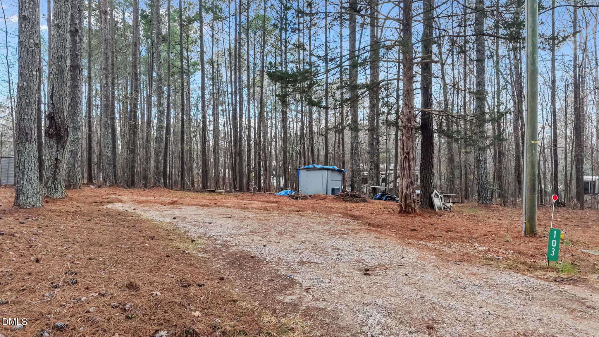 115 Mahto Drive Spring Hope, NC 27882 - Photo 17 of 19 a backyard of a house with lawn chairs and wooden fence