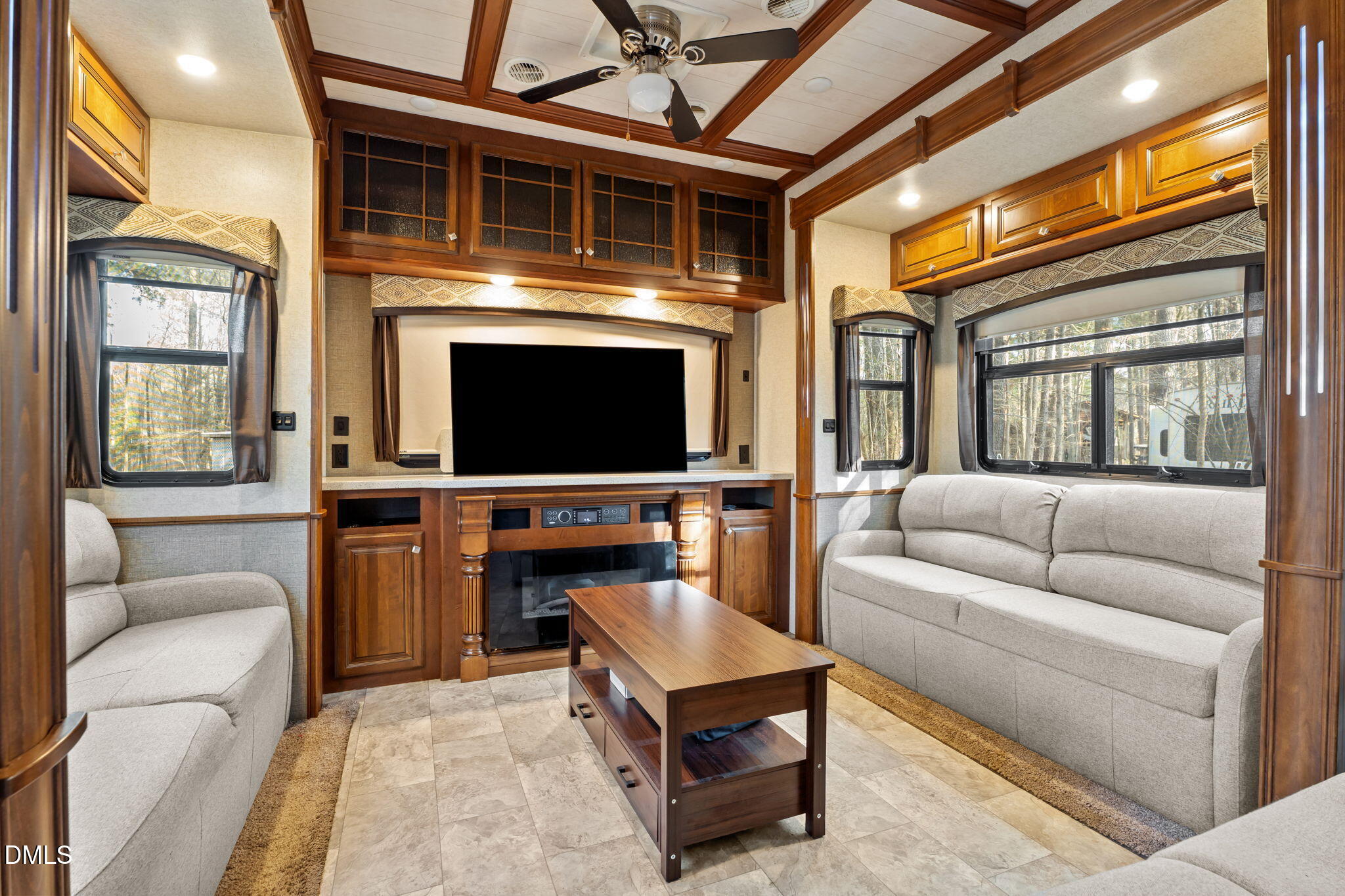 115 Mahto Drive Spring Hope, NC 27882 - Photo 2 of 19 a living room with furniture a flat screen tv and a fireplace