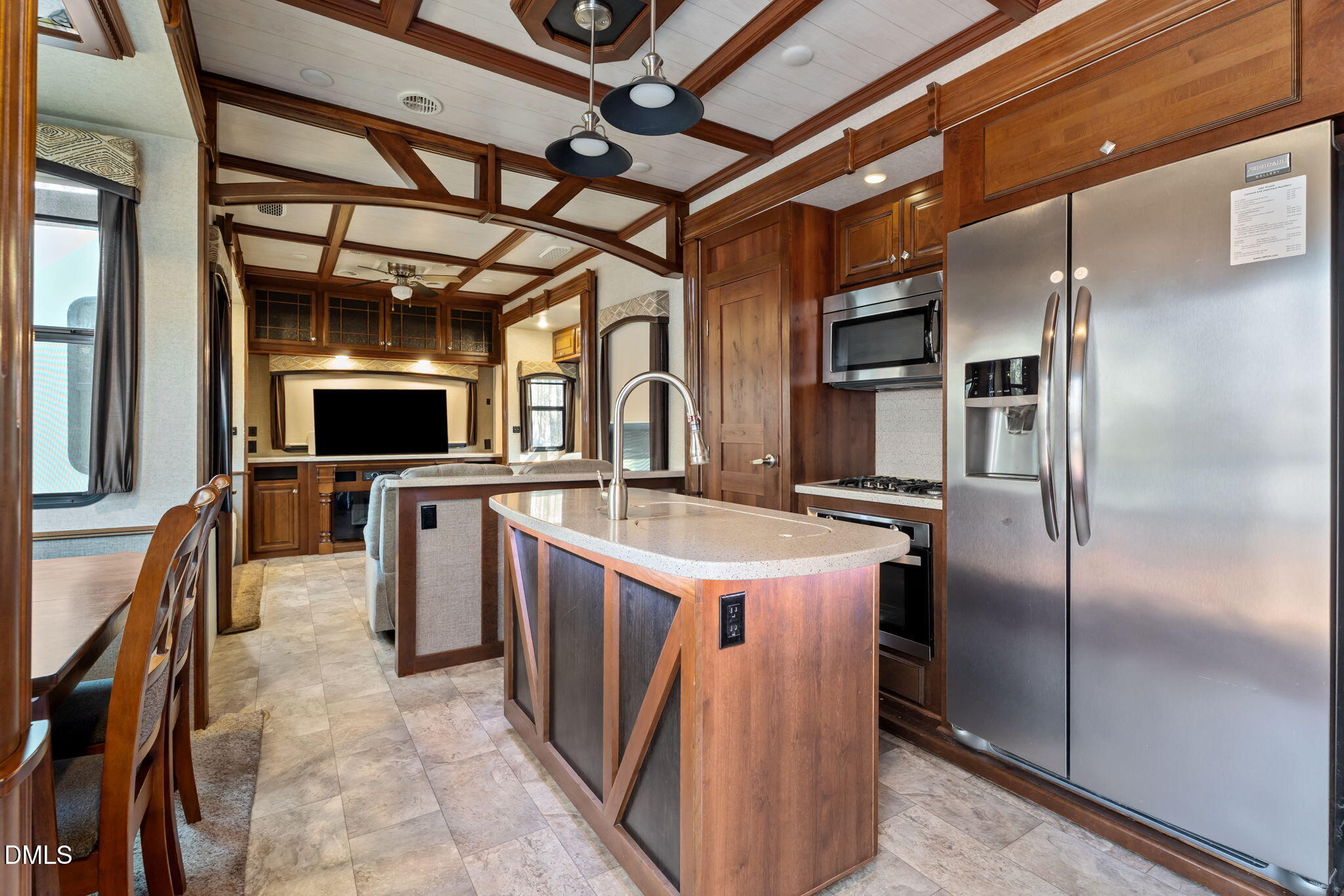 115 Mahto Drive Spring Hope, NC 27882 - Photo 4 of 19 a kitchen with stainless steel appliances granite countertop a sink a stove and a refrigerator
