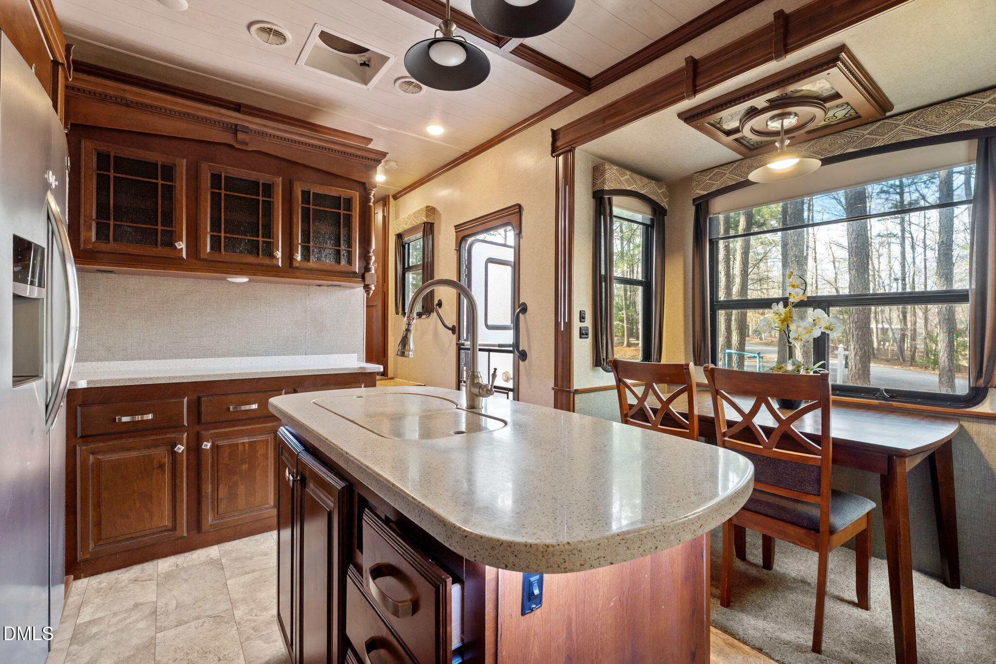 115 Mahto Drive Spring Hope, NC 27882 - Photo 6 of 19 a dining hall with stainless steel appliances granite countertop a dining table and chairs