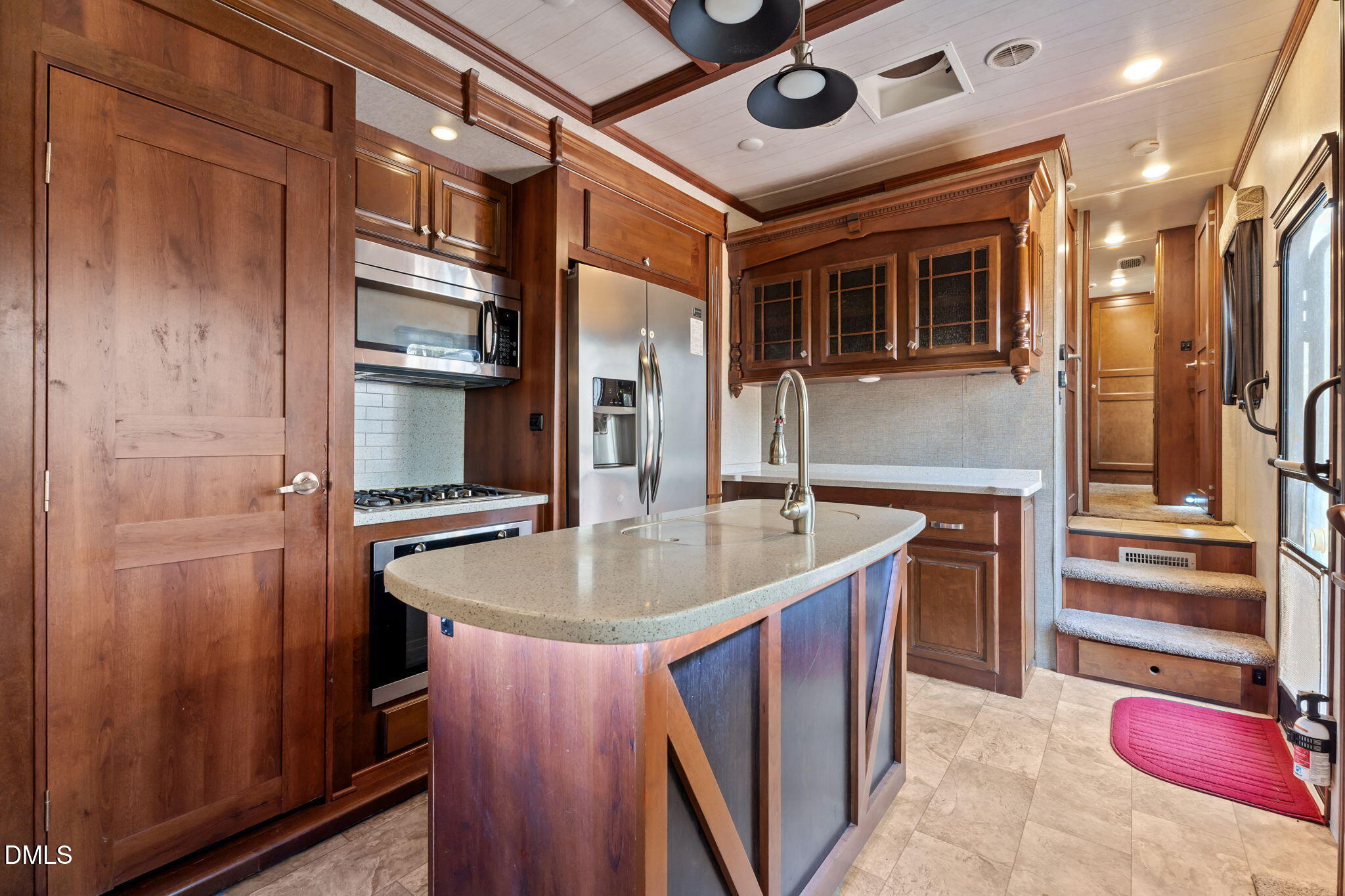 115 Mahto Drive Spring Hope, NC 27882 - Photo 7 of 19 a kitchen with stainless steel appliances granite countertop a sink and a refrigerator