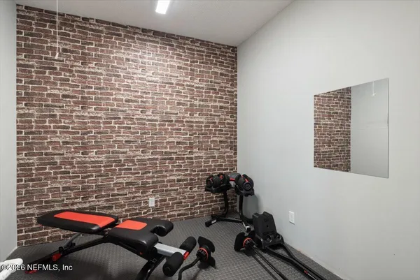 a view of a chairs and table in a patio