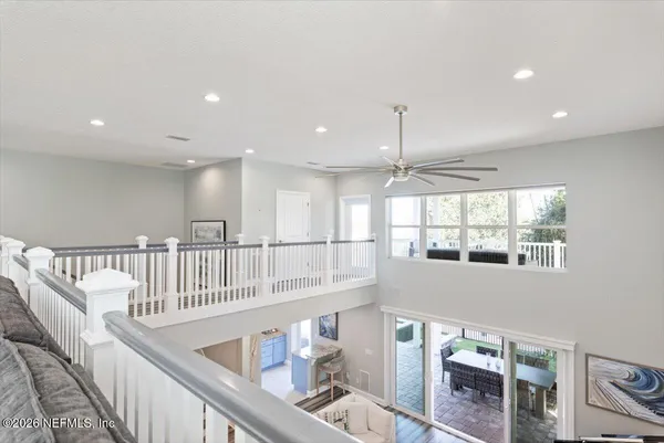 a view of a patio with a table and chairs and potted plants