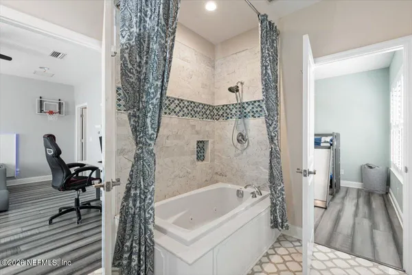 a view of an outdoor dining space with a table and chairs