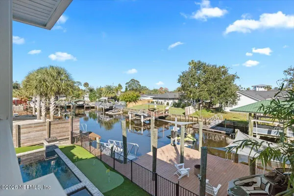 a view of a house with backyard porch and sitting area