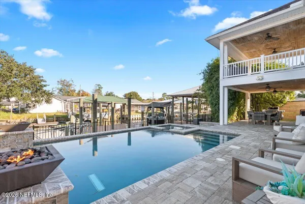 a view of a swimming pool with a lounge chairs