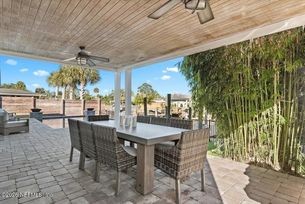 a view of a backyard with sitting area
