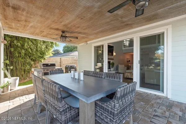 a terrace with outdoor seating and city view