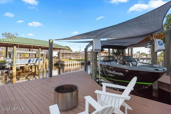 a room with table chairs and wooden floor