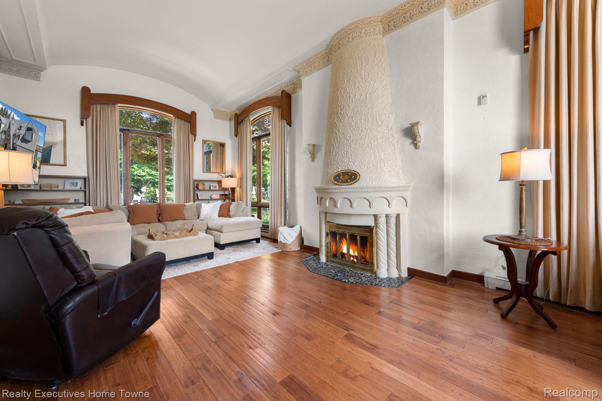 8308 Lakeshore Road Fort Gratiot, MI 48059 - Photo 43 of 79 Living area with wood-finish flooring and a decorative fireplace featuring an ornate mantel