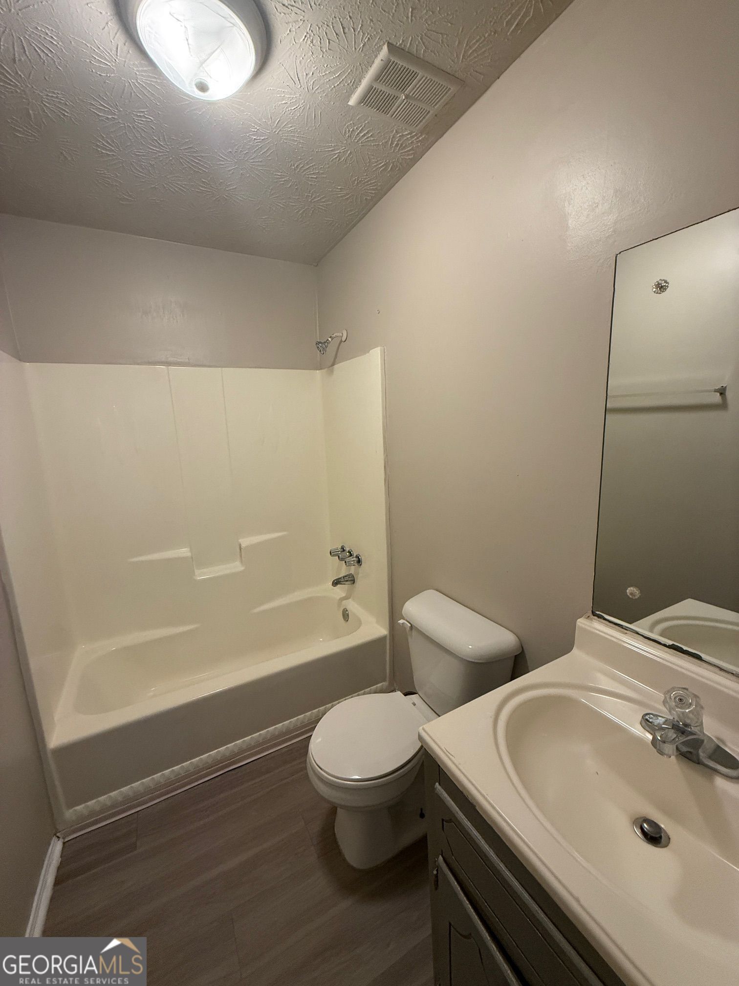 255 Rustwood Drive Athens, GA 30606 - Photo 3 of 9 a bathroom with a toilet sink and a bathtub
