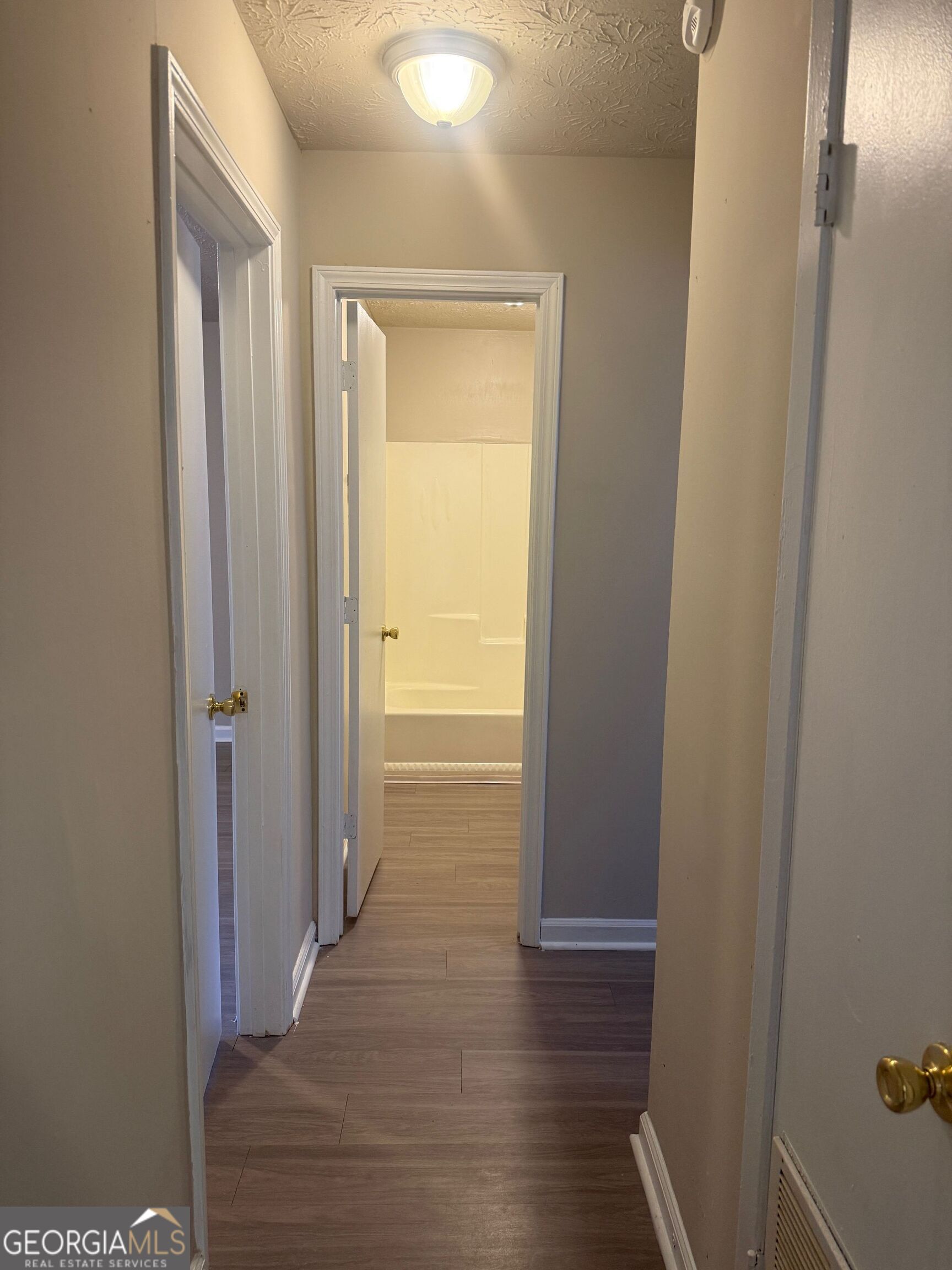 255 Rustwood Drive Athens, GA 30606 - Photo 5 of 9 a view of a hallway with wooden floor