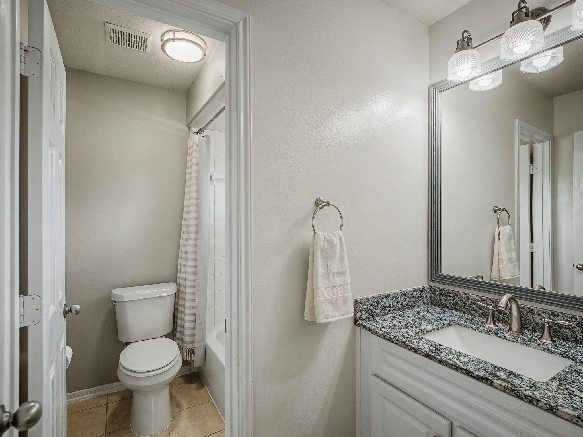 2210 Fox Path Katy, TX 77494 - Photo 35 of 47 This beautifully coordinated upstairs full bathroom is thoughtfully configured to maximize privacy and efficiency for family members sharing the space. A separate door divides the vanity area from the toilet and shower-tub combination.