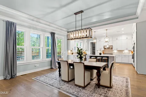 a dining room with chandelier