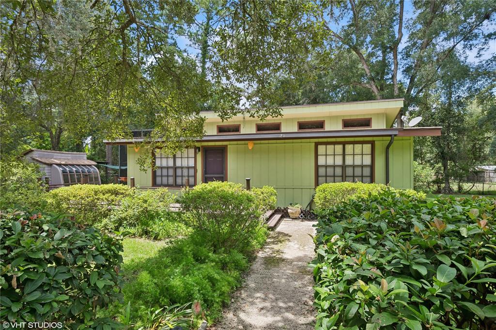front view of a house with a garden