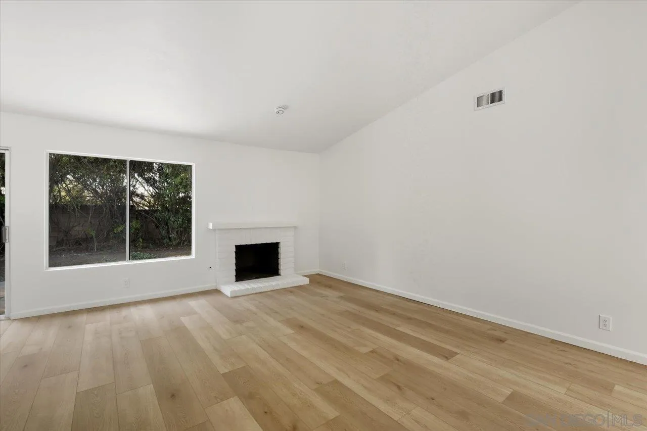 1708 Woodbridge Road Escondido, CA 92026 - Photo 18 of 38 wooden floor in an empty room with a window